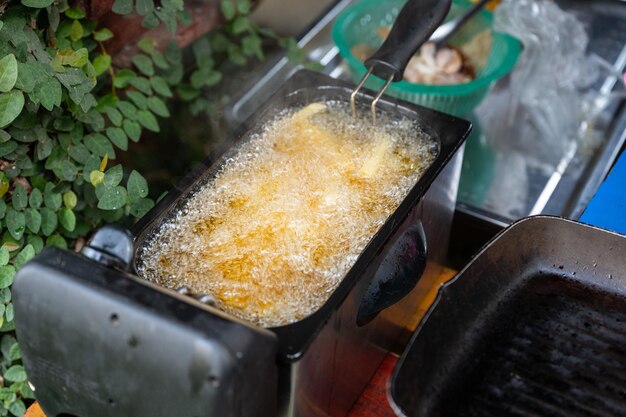 Deep frying French Fries in deep fryer