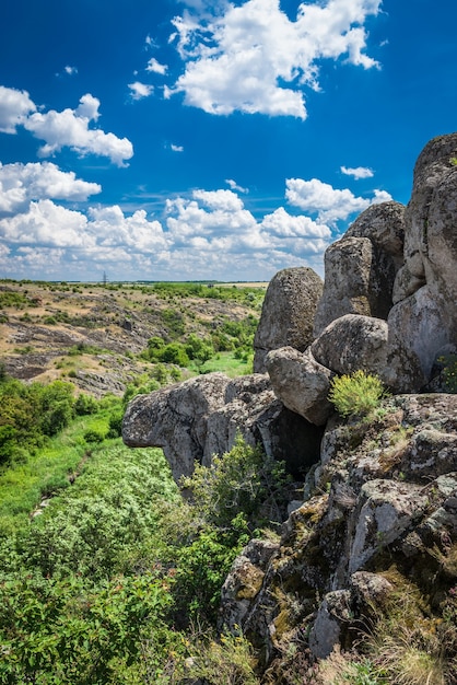 deep granite Aktovo canyon with river and cloudy sky