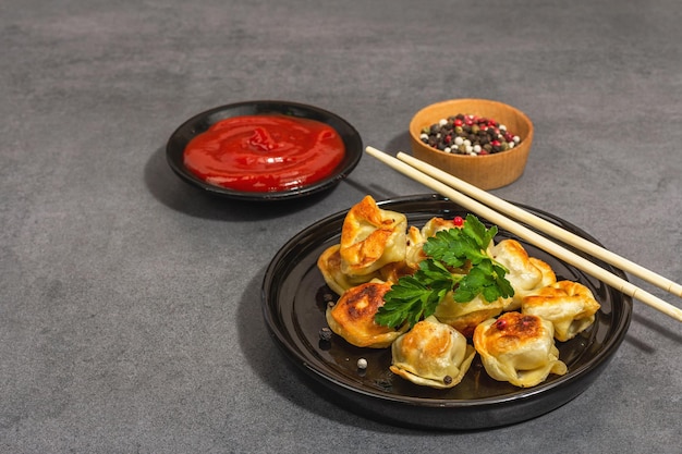 Deepfried dumplings with tomato sauce and pepper mix Vegan food modern hard light dark shadow