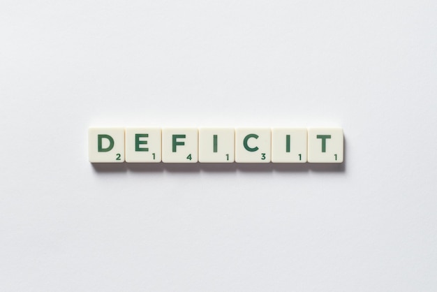 Deficit formed of scrabble blocks