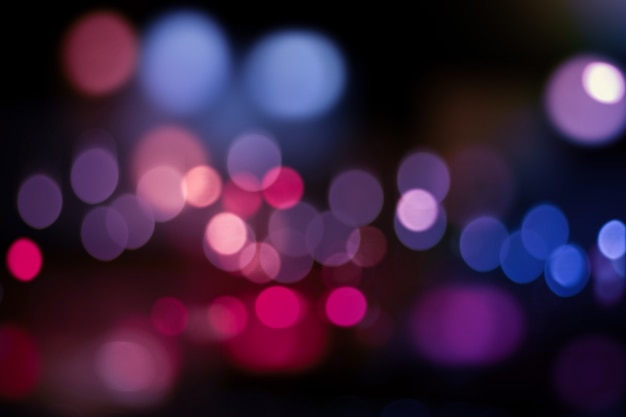 Defocused city night filtered bokeh abstract background.