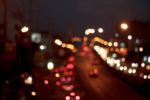 Defocused city night filtered bokeh abstract background.