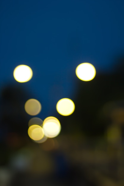 Photo defocused city night filtered bokeh abstract background.