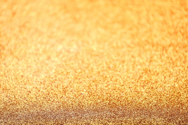 Defocused gold abstract texture glitter background