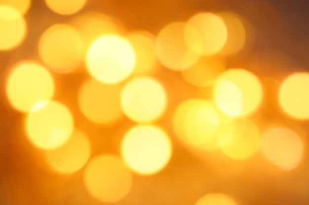 Defocused golden lights abstract bokeh background festive texture