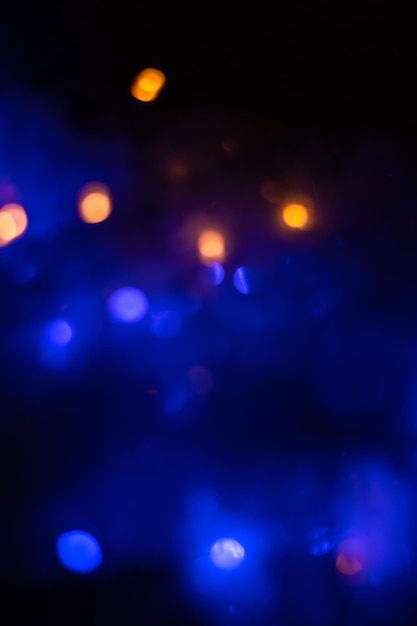 Defocused Lights and Dust Particles over Black Background