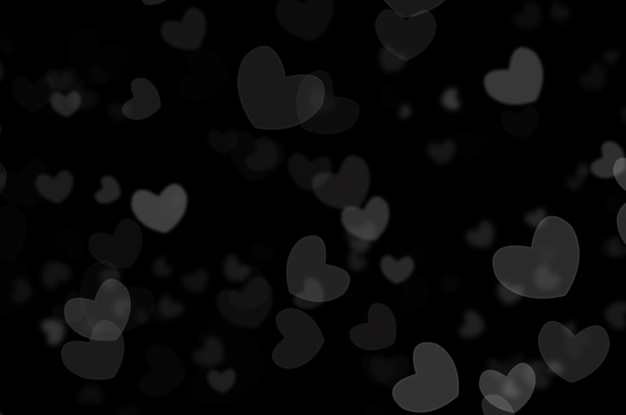 Defocused lights in the form of a heart on a black background