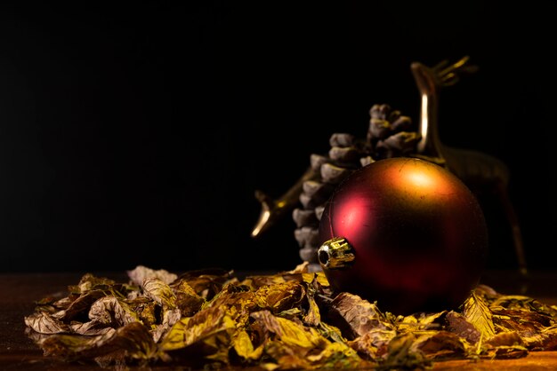 Defocused metal deer with red christmas ball