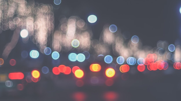 Defocused night Street lights. Bokeh street lights from cars in the city.