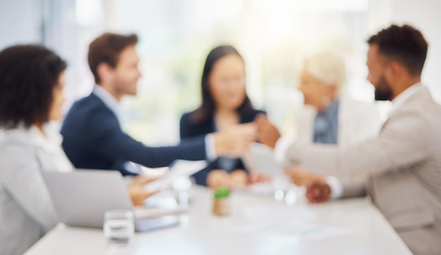 Defocused office business meeting and people teamwork cooperation or collaboration on planning discussion Blurred strategy group coworking lawyers and workplace team consulting talking or chat