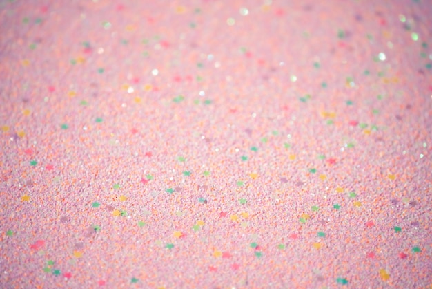 Defocused pink background with shiny stars Abstract pink blurred background