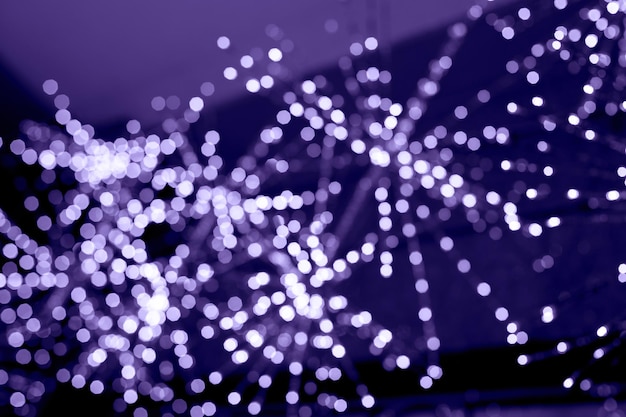 Defocused violet abstract bokeh lights background blurred