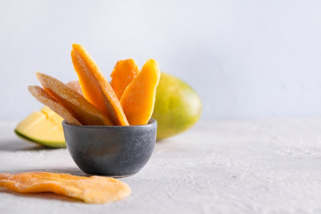 Dehydrated and dried mango chips. Close up.