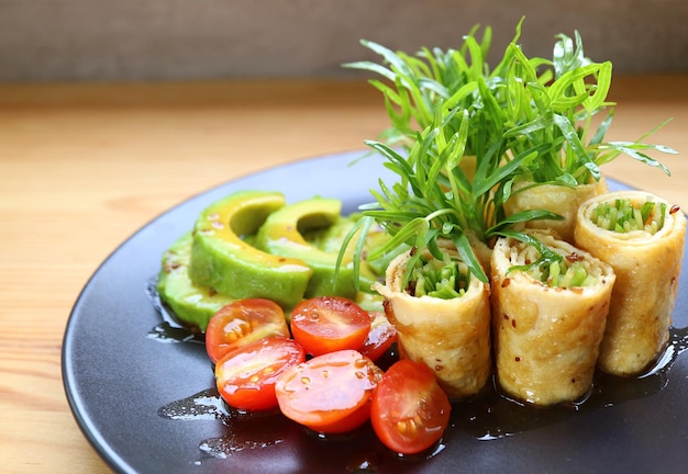 Delectable Freshly Harvest Water Spinach Microgreens Egg Rolls with Avocado and Tomato Salad