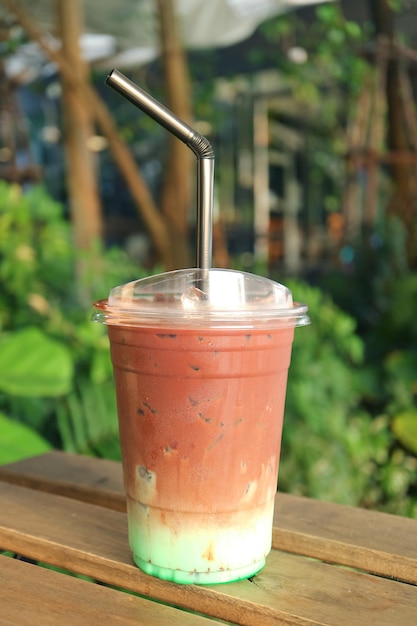 Delectable Iced Mint Chocolate Latte Isolated on Garden Table