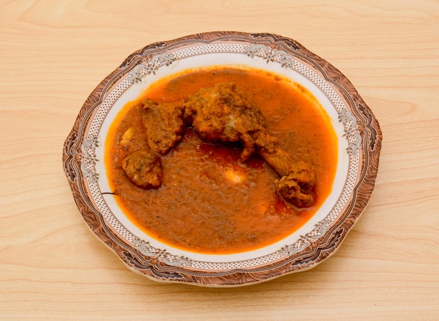 Delhi chicken korma served in dish isolated on table top view indian spicy food