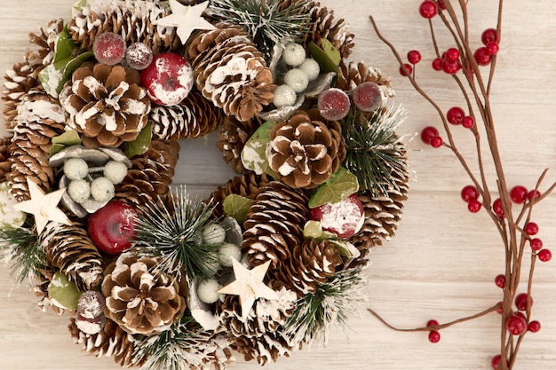 Delicate Christmas wreath of pine cones  