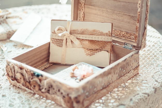 Photo delicate composition with letters in a box decorated in rustic s