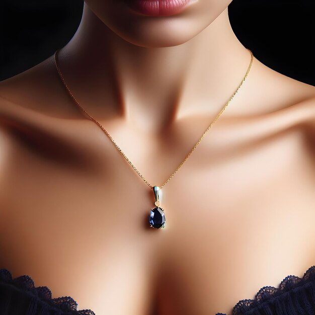 delicate golden necklace with a sapphire pendant worn by a model closeup isolated on blackbackground