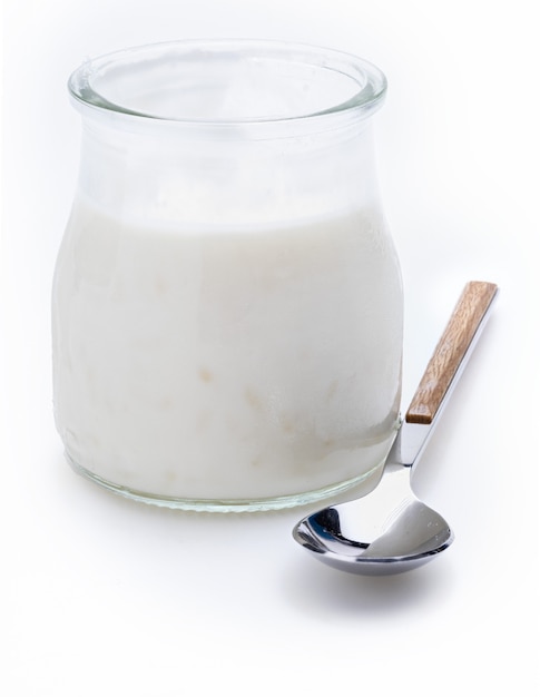 Delicate rice pudding in a glass jar and spoon