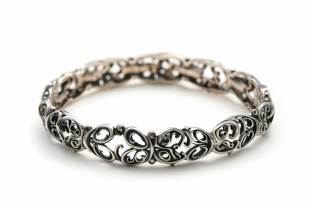 Delicate silver bracelet showcasing intricate designs resting against a clean soft background