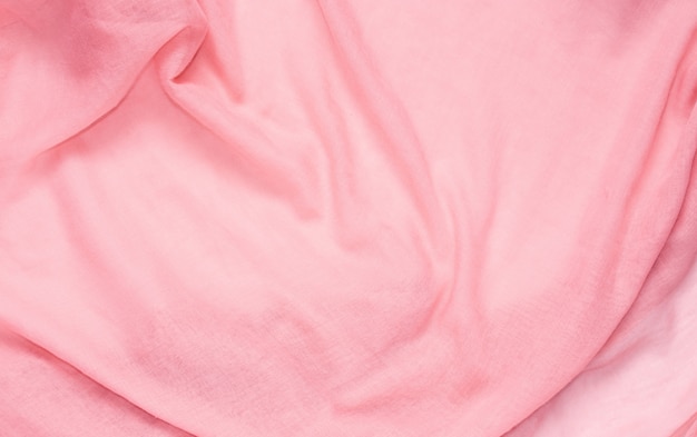 Delicate soft and wrinkled fabric pink color background texture