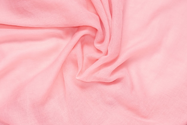 Delicate soft and wrinkled fabric pink color background texture