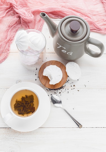 Delicate white pink marshmallows with fragrant tea