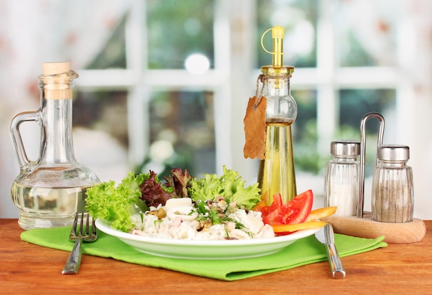 Delicatessen seafood salad with rice on bright background