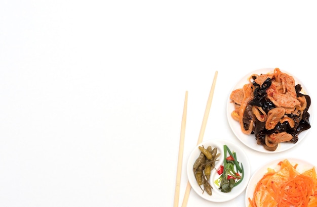 Delicious asian various salads with chopsticks and on white background Selective focus Asian food concept