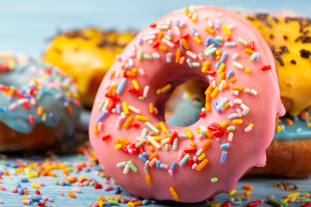 Delicious assorted colorful donuts on the table