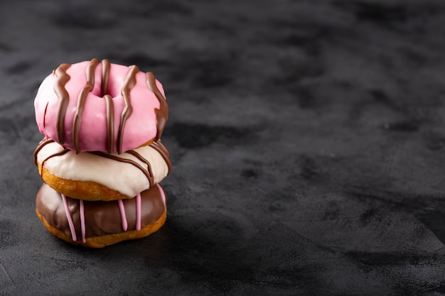 Delicious assorted colorful donuts on the table