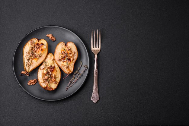 Delicious baked pear with dorblu cheese walnut and honey on a textured concrete background