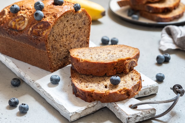 Delicious banana bread loaf with blueberries on a table