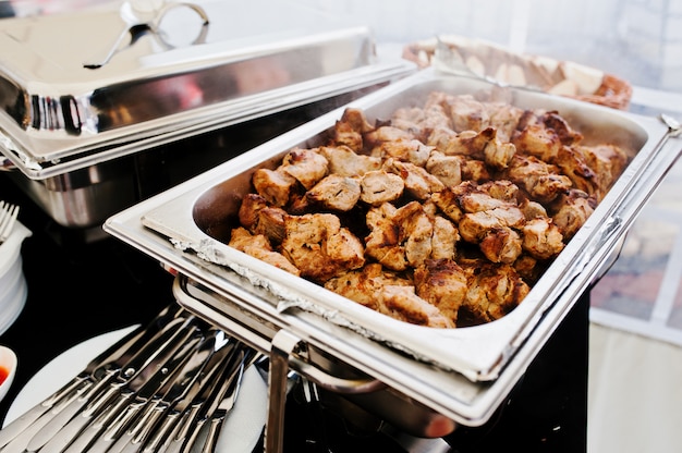 Delicious barbecue at buffet on table