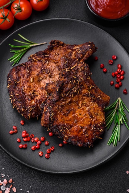 Delicious beef or pork steak on the bone grilled with spices and rosemary