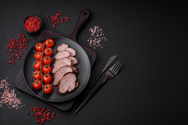 Delicious beef steak with salt spices and herbs on a ceramic plate