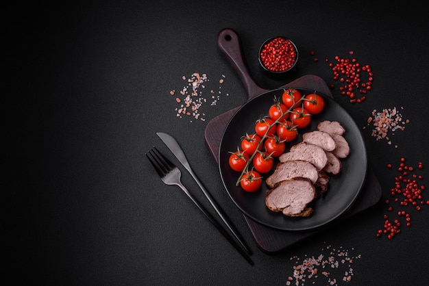 Delicious beef steak with salt spices and herbs on a ceramic plate