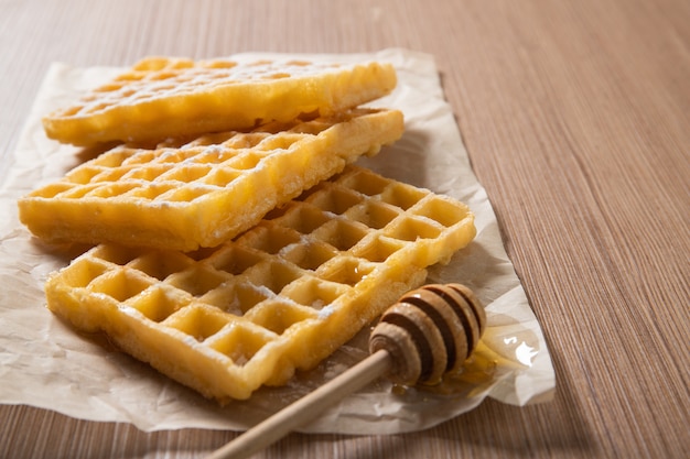 Delicious Belgian waffles with honey. Bakery products. Food