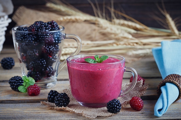 Delicious blackberry and raspberry smoothie, detox yogurt or milkshake with fresh berries