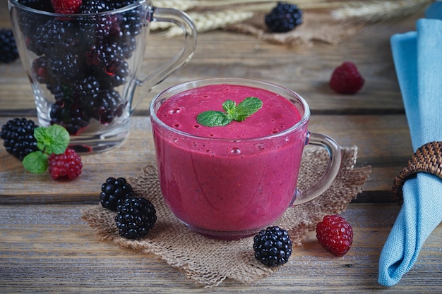 Delicious blackberry and raspberry smoothie, detox yogurt or milkshake with fresh berries