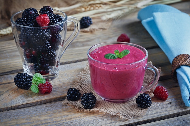 Delicious blackberry and raspberry smoothie, detox yogurt or milkshake with fresh berries