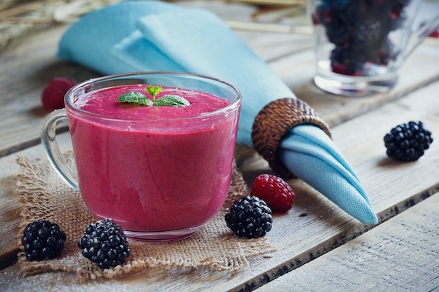 Delicious blackberry and raspberry smoothie, detox yogurt or milkshake with fresh berries