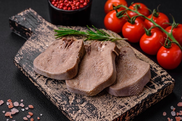 Delicious boiled beef tongue sliced with vegetables and spices