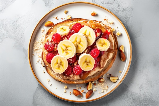 Delicious breakfast sandwich with peanut butter banana and raspberry on a stone table top