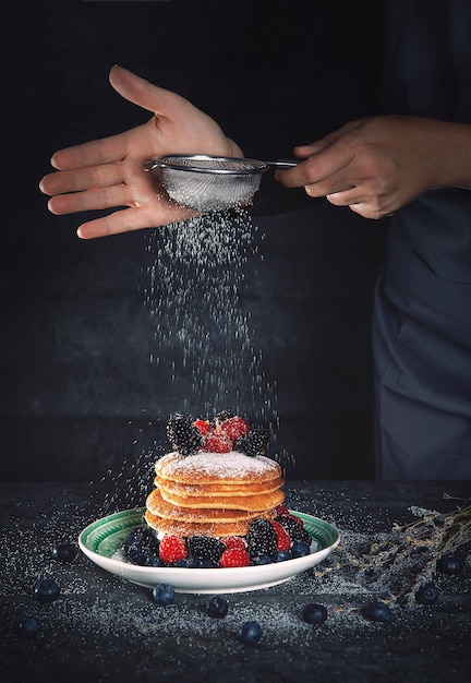 A delicious breakfast with pancakes and berries