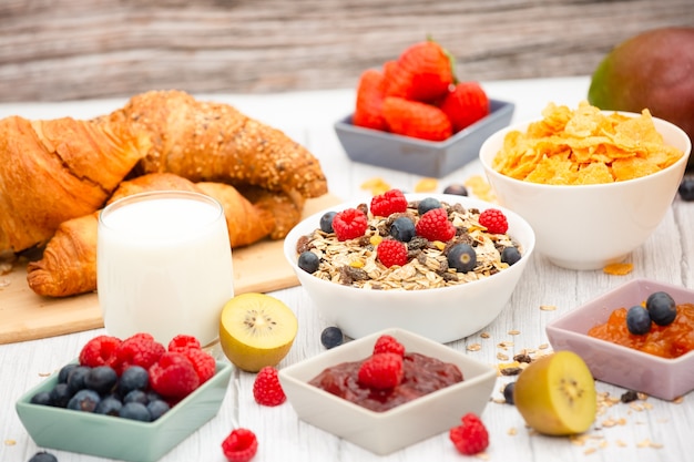 Delicious breakfast with pastry and cereals ready to be served