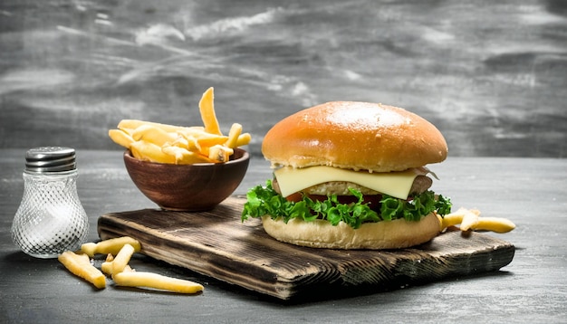 Delicious Burger With Cheese And French Fries