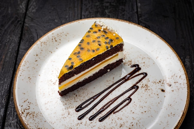 delicious cake with cream on a wooden background