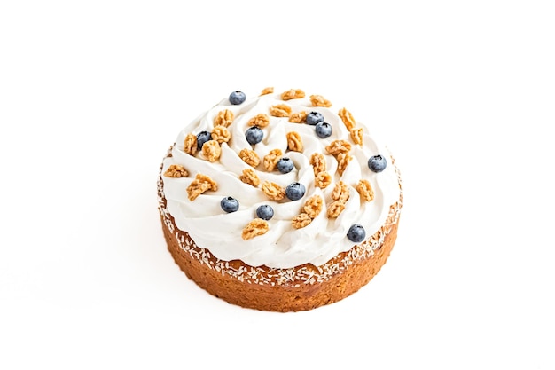 Delicious Cake with Whipped Cream Walnuts and Blueberries